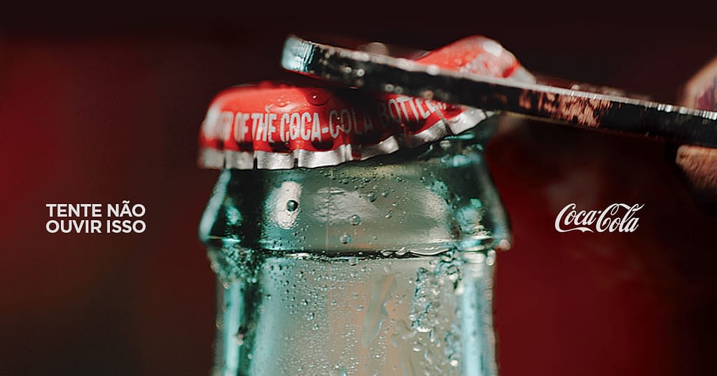 Anúncio da Coca-Cola que promete fazer você ouvir o som.